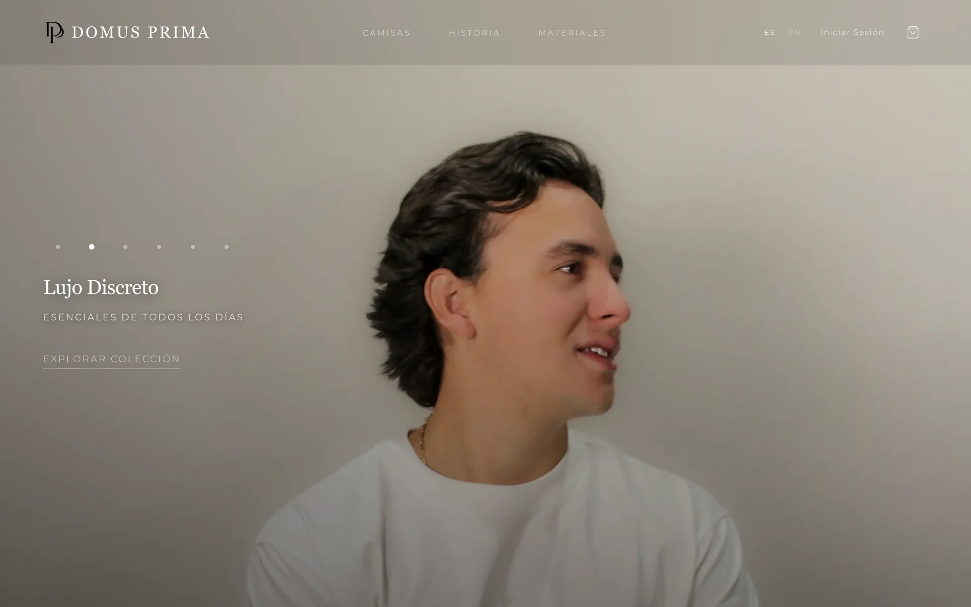 Cinematic hero — "Quiet Luxury / Everyday Essentials / Explore Collection". 4-second loading ceremony, model in premium white shirt. Nav: SHIRTS, STORY, MATERIALS